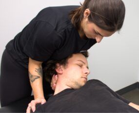 Clinician helping male patient