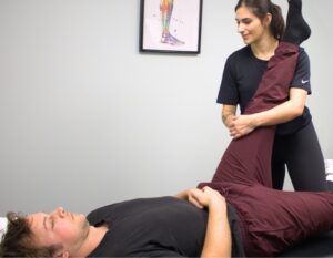Clinician helping male patient